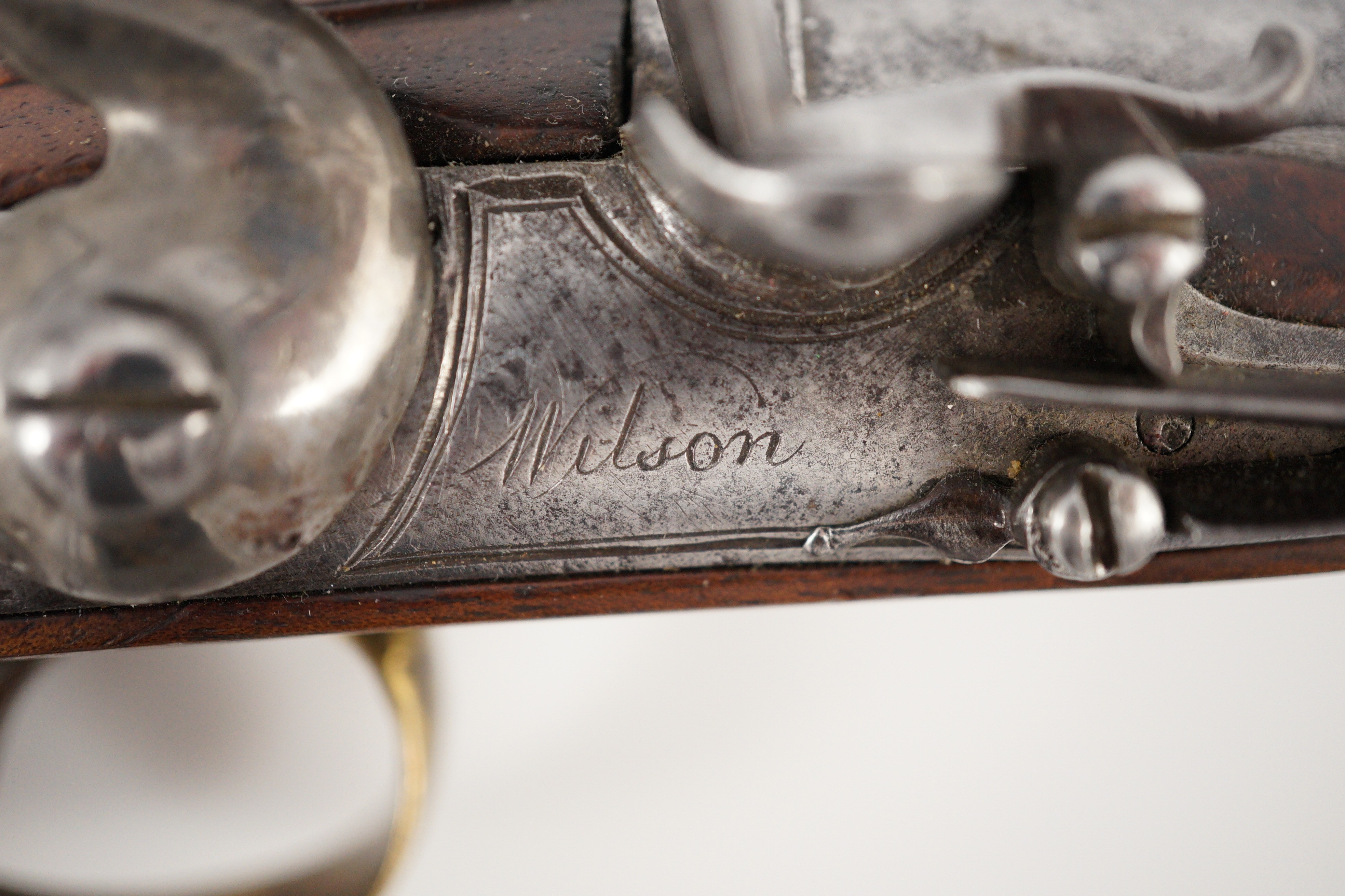 Wilson of London. An early 18th century flintlock pocket pistol, 11cm high 19cm long